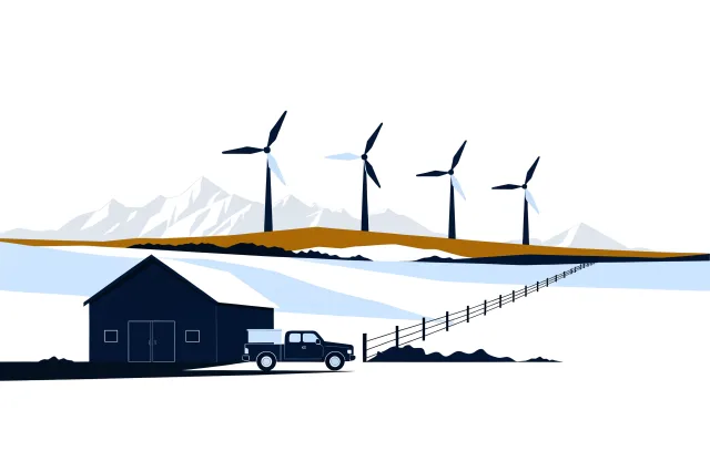 Alberta foothills ranch with a barn, fence line, pickup truck and wind turbines below the Rockies.