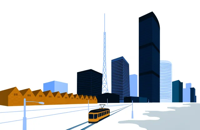Toronto skyline with office towers, brick warehouses and a streetcar on a wide street.